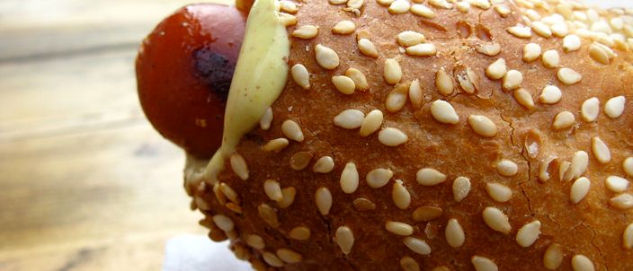 An Icelandic pylsa — a lamb-and-pork sausage — in a sesame bun with remoulade, close up.