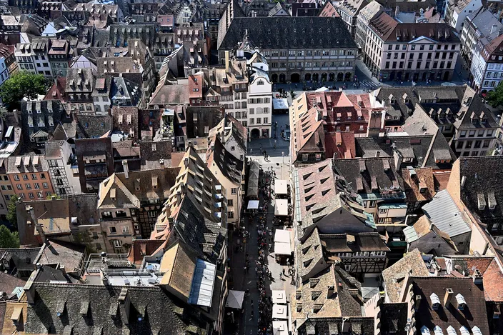 The roofs of Strasbourg's old town seen from high on the cathedral, with Rue Mercière running straight below towards Place Gutenberg